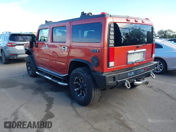 2003 Hummer H2 with VIN 5GRGN23U23H104200, listed as a IAAI auction lot 41687769 with 1 mi miles. Bid and sale history available at carsss.com. Image 3.