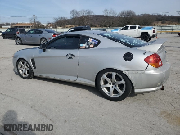 2003 Hyundai Tiburon GT z VIN KMHHN65F13U102985, wystawiony jako Copart lot #45294325 z przebiegiem 326 919 mil mil oraz Szkoda całkowita • Salvage title. Historia ofert i sprzedaży dostępna na DreamBid. Obrazek 2.