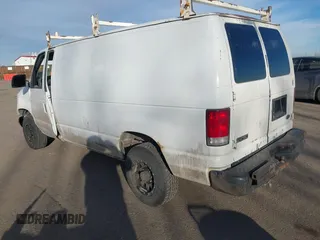 2001 Ford Econoline Cargo Commercial with VIN 1FTNE24L21HA95140, listed as a IAAI auction lot 41490323 with 330,136 mi miles and . Bid and sale history available at carsss.com. Image 3.