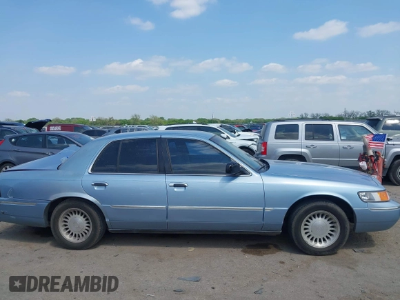 2000 Mercury Grand Marquis LS z VIN 2MEFM75W1YX673105, wystawiony jako IAAI lot #42050980 z przebiegiem 154 944 mil mil oraz . Historia ofert i sprzedaży dostępna na DreamBid. Obrazek 13.