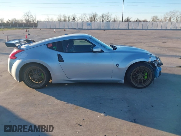 2014 Nissan 370Z Nismo with VIN JN1AZ4EH4EM634236, listed as a IAAI auction lot 41256664 with 80,294 mi miles and . Bid and sale history available at DreamBid. Image 12.