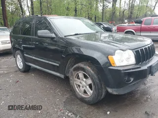 2007 Jeep Grand Cherokee Laredo with VIN 1J8GS48K57C516037, listed as a IAAI auction lot 41982692 with 273,961 mi miles. Bid and sale history available at carsss.com. Image 1.