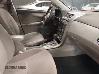 2011 Toyota Corolla L with VIN JTDBU4EE3BJ102060, listed as a IAAI auction lot 42140081 with 125,989 mi miles. Bid and sale history available at carsss.com. Image 5.