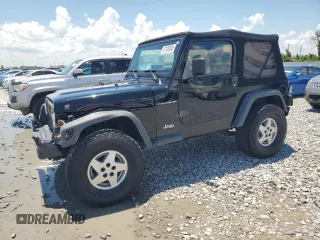 2002 Jeep Wrangler Sport z VIN 1J4FA49S72P700833, wystawiony jako Copart lot #67198335 z przebiegiem 126 362 mil mil oraz Szkoda całkowita • Salvage title. Historia ofert i sprzedaży dostępna na DreamBid. Obrazek 1.