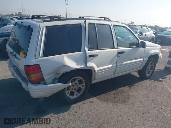 1998 Jeep Grand Cherokee with VIN 1J4FX78S2WC281501, listed as a IAAI auction lot 42140170 with 177,575 mi miles and . Bid and sale history available at DreamBid. Image 4.