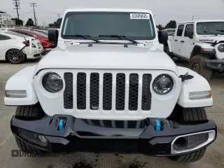 2023 Jeep Wrangler Sahara with VIN 1C4JJXP63PW536694, listed as a Copart auction lot 63409845 with 32,560 mi miles and Salvage title. Bid and sale history available at DreamBid. Image 5.