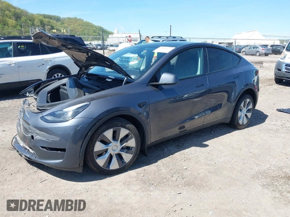 2023 Tesla Model Y Long Range z VIN 7SAYGDEE8PA191415, wystawiony jako IAAI lot #42155577 z przebiegiem 42 149 mil mil oraz . Historia ofert i sprzedaży dostępna na DreamBid. Obrazek 2.