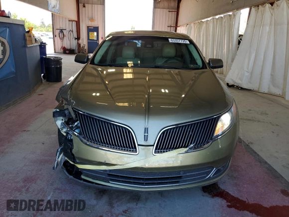 2013 Lincoln MKS EcoBoost with VIN 1LNHL9FT2DG604657, listed as a Copart auction lot 65357735 with 133,548 mi miles and Salvage title. Bid and sale history available at DreamBid. Image 5.