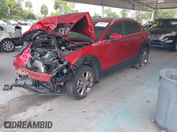 2023 Mazda CX-30 S Carbon Edition with VIN 3MVDMBCM3PM537841, listed as a IAAI auction lot 42080487 with 22,718 mi miles and . Bid and sale history available at DreamBid. Image 2.