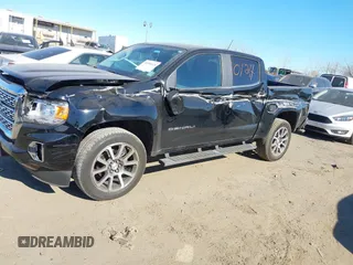 2021 GMC Canyon 4WD Denali z VIN 1GTG6EEN9M1240596, wystawiony jako IAAI lot #40760124 z przebiegiem 52 985 mil mil oraz . Historia ofert i sprzedaży dostępna na DreamBid. Obrazek 18.