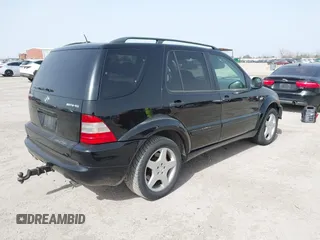 2001 Mercedes-Benz M-Class AMG with VIN 4JGAB74E51A272841, listed as a IAAI auction lot 41734340 with 168,387 mi miles. Bid and sale history available at carsss.com. Image 4.