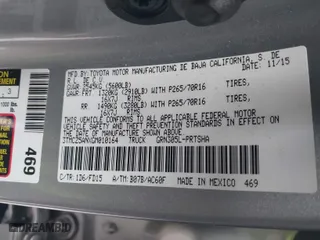 2016 Toyota Tacoma SR with VIN 3TMCZ5ANXGM010164, listed as a IAAI auction lot 41802736 with 201,697 mi miles. Bid and sale history available at carsss.com. Image 9.