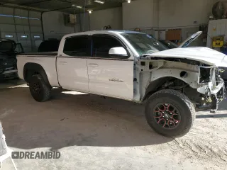 2021 Toyota Tacoma 4WD SR5 with VIN 3TMDZ5BN4MM103311, listed as a Copart auction lot 46486445 with 125,685 mi miles and Salvage Title. Bid and sale history available at carsss.com. Image 4.