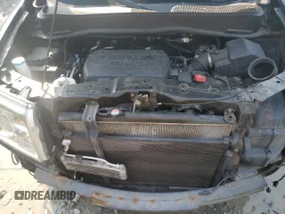 2011 Honda Pilot Touring z VIN 5FNYF4H92BB090512, wystawiony jako Copart lot #57046015 z przebiegiem 159 814 mil mil oraz Szkoda całkowita • Salvage title. Historia ofert i sprzedaży dostępna na DreamBid. Obrazek 12.