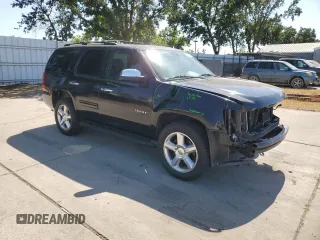 2014 Chevrolet Tahoe LT with VIN 1GNSCBE07ER115998, listed as a Copart auction lot 59577485 with 154,486 mi miles and Salvage title. Bid and sale history available at DreamBid. Image 4.