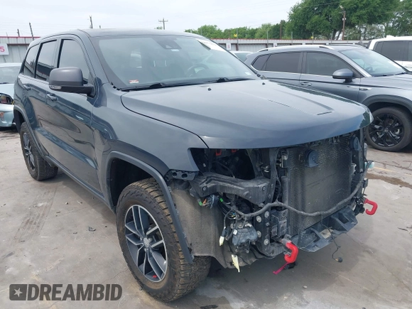 2017 Jeep Grand Cherokee Trailhawk with VIN 1C4RJFLG4HC843628, listed as a IAAI auction lot 42053878 with 83,551 mi miles and . Bid and sale history available at DreamBid. Image 1.
