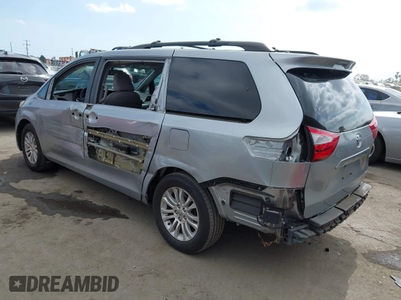 2015 Toyota Sienna XLE with VIN 5TDYK3DC1FS611521, listed as a IAAI auction lot 42136356 with 102,734 mi miles. Bid and sale history available at carsss.com. Image 3.