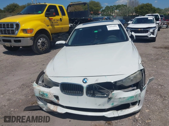 2014 BMW 3 Series 320i with VIN WBA3B1C51EK131063, listed as a IAAI auction lot 42043086 with 92,306 mi miles. Bid and sale history available at carsss.com. Image 12.