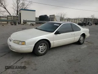 1997 Ford Thunderbird LX with VIN 1FALP62W5VH124101, listed as a Copart auction lot 47547695 with 148,828 mi miles and Salvage Title. Bid and sale history available at carsss.com. Image 1.