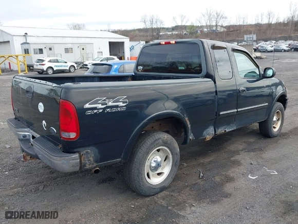 2000 Ford F-150 XL with VIN 1FTRX18WXYNC25817, listed as a IAAI auction lot 41976618 with 148,794 mi miles. Bid and sale history available at carsss.com. Image 4.