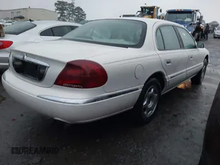 2001 Lincoln Continental with VIN 1LNHM97V51Y670610, listed as a IAAI auction lot 41439804 with 160,114 mi miles. Bid and sale history available at carsss.com. Image 4.