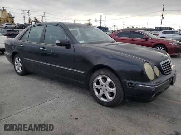2002 Mercedes-Benz E-Class with VIN WDBJF65J42B486633, listed as a Copart auction lot 76979054 with 151,429 mi miles and Salvage Title. Bid and sale history available at carsss.com. Image 4.