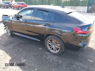 2021 BMW X4 M40i with VIN 5UX2V5C03M9H54824, listed as a IAAI auction lot 41817714 with 34,880 mi miles. Bid and sale history available at carsss.com. Image 3.