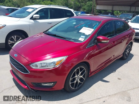 2016 Ford Focus SE z VIN 1FADP3F28GL237888, wystawiony jako IAAI lot #42564140 z przebiegiem 143 210 mil mil oraz . Historia ofert i sprzedaży dostępna na DreamBid. Obrazek 2.