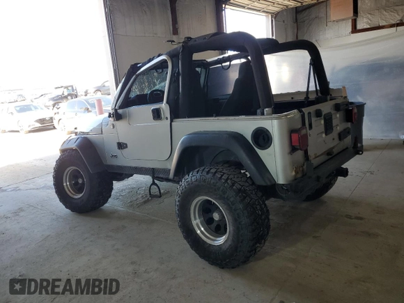 2006 Jeep Wrangler Rubicon with VIN 1J4FA69S26P734731, listed as a Copart auction lot 52009295 with 117,872 mi miles and Salvage title. Bid and sale history available at DreamBid. Image 2.