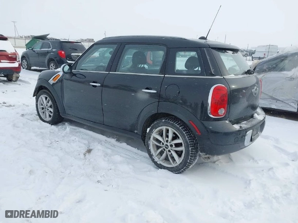 2011 MINI Cooper Countryman with VIN WMWZB3C55BWH95220, listed as a IAAI auction lot 41561228 with 124,584 mi miles. Bid and sale history available at carsss.com. Image 3.