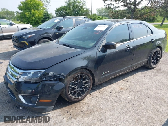2012 Ford Fusion Hybrid z VIN 3FADP0L32CR364546, wystawiony jako IAAI lot #42418735 z przebiegiem 148 242 mil mil oraz . Historia ofert i sprzedaży dostępna na DreamBid. Obrazek 2.