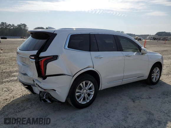2024 Cadillac XT6 FWD Luxury with VIN 1GYKPAR47RZ705252, listed as a Copart auction lot 49244015 with 26,838 mi miles and Salvage title. Bid and sale history available at DreamBid. Image 3.