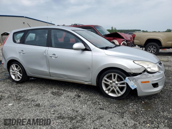 2009 Hyundai Elantra Touring z VIN KMHDC86E29U038194, wystawiony jako Copart lot #57483375 z przebiegiem 218 337 mil mil oraz Szkoda całkowita • Salvage title. Historia ofert i sprzedaży dostępna na DreamBid. Obrazek 4.