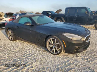 2020 BMW Z4 sDrive30i with VIN WBAHF3C03LWW64905, listed as a Copart auction lot 77010554 with 27,612 mi miles and Salvage Title. Bid and sale history available at carsss.com. Image 4.