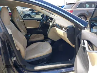 2014 Tesla Model S 60 with VIN 5YJSA1H18EFP31969, listed as a IAAI auction lot 42312485 with 90,043 mi miles and . Bid and sale history available at DreamBid. Image 5.