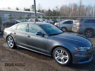 2014 Audi A6 Prestige z VIN WAUHGBFC8EN104920, wystawiony jako IAAI lot #41827864 z przebiegiem 70 289 mil mil oraz . Historia ofert i sprzedaży dostępna na DreamBid. Obrazek 1.