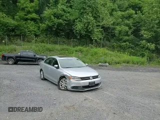 2013 Volkswagen Jetta SE z VIN 3VWDP7AJXDM296643, wystawiony jako Copart lot #60992095 z przebiegiem 159 637 mil mil oraz Szkoda całkowita • Salvage title. Historia ofert i sprzedaży dostępna na DreamBid. Obrazek 13.