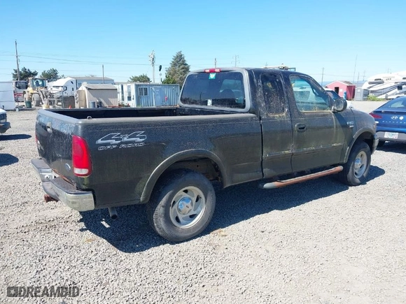 2000 Ford F-150 XL with VIN 1FTRX18L6YKB06492, listed as a IAAI auction lot 42058110 with 169,217 mi miles. Bid and sale history available at carsss.com. Image 4.