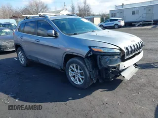 2014 Jeep Cherokee Altitude with VIN 1C4PJMCB5EW167961, listed as a IAAI auction lot 41660440 with 88,705 mi miles and . Bid and sale history available at DreamBid. Image 1.
