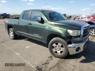 2011 Toyota Tundra 4WD Truck with VIN 5TFUY5F18BX195945, listed as a Copart auction lot 72439794 with 166,453 mi miles and Salvage Title. Bid and sale history available at carsss.com. Image 4.