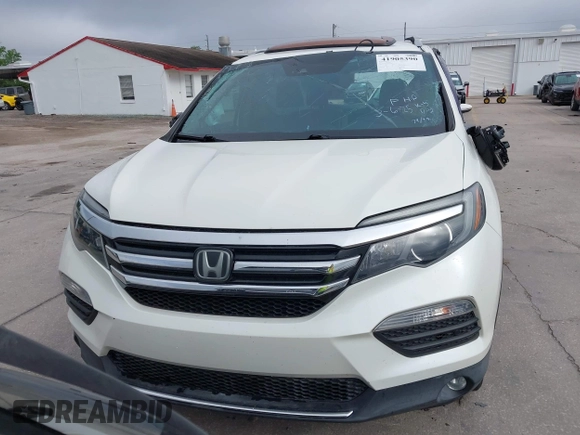 2016 Honda Pilot Elite with VIN 5FNYF6H00GB104329, listed as a IAAI auction lot 41905390 with 125,501 mi miles. Bid and sale history available at carsss.com. Image 12.