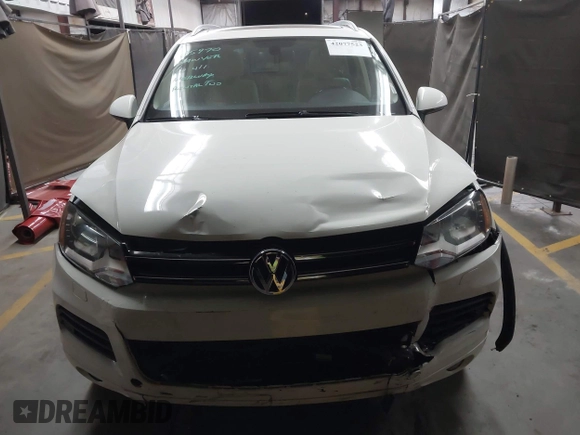 2012 Volkswagen Touareg Sport with VIN WVGFK9BP2CD002991, listed as a IAAI auction lot 42077523 with 94,515 mi miles and . Bid and sale history available at DreamBid. Image 12.