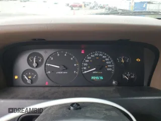 2002 Jeep Grand Cherokee z VIN 1J4GX38S72C152046, wystawiony jako Copart lot #57963095 z przebiegiem 204 576 mil mil oraz Szkoda całkowita • Salvage title. Historia ofert i sprzedaży dostępna na DreamBid. Obrazek 9.