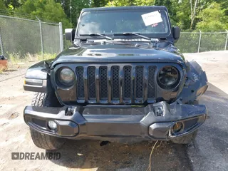 2020 Jeep Wrangler Unlimited Sahara z VIN 1C4HJXEN6LW106869, wystawiony jako IAAI lot #42390113 z przebiegiem 56 907 mil mil oraz . Historia ofert i sprzedaży dostępna na DreamBid. Obrazek 13.