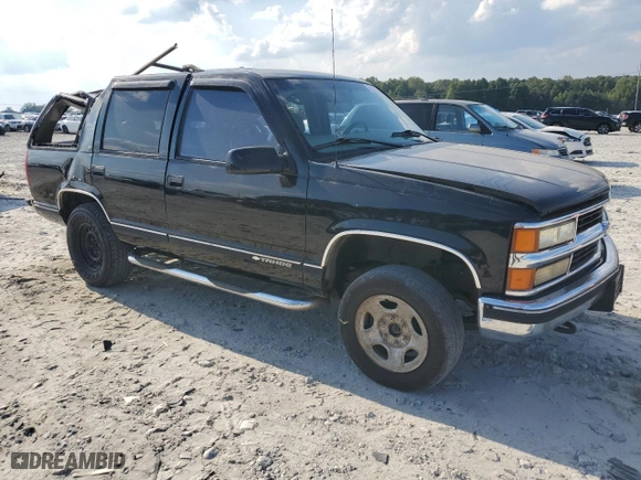 1999 Chevrolet Tahoe Z71 with VIN 1GNEK13R1XJ380316, listed as a Copart auction lot 68505524 with 242,542 mi miles and Salvage Title. Bid and sale history available at carsss.com. Image 4.