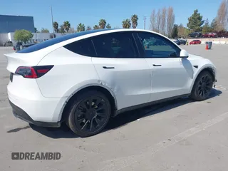2021 Tesla Model Y Long Range with VIN 5YJYGDEEXMF280480, listed as a IAAI auction lot 41993633 with 69,579 mi miles. Bid and sale history available at carsss.com. Image 4.
