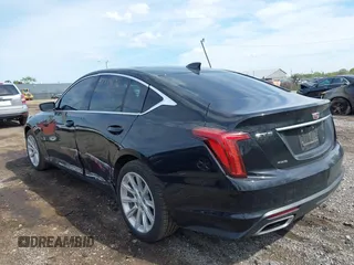 2021 Cadillac CT5 Luxury z VIN 1G6DX5RKXM0146235, wystawiony jako IAAI lot #42214676 z przebiegiem 72 847 mil mil oraz . Historia ofert i sprzedaży dostępna na DreamBid. Obrazek 3.
