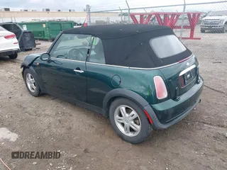 2005 MINI Convertible with VIN WMWRF33495TG11818, listed as a IAAI auction lot 42351446 with 100,033 mi miles and . Bid and sale history available at DreamBid. Image 3.