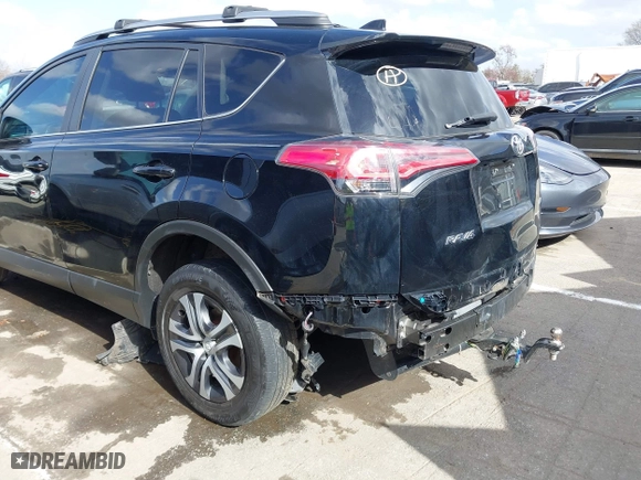 2018 Toyota RAV4 LE with VIN 2T3ZFREV9JW457062, listed as a IAAI auction lot 41696609 with 96,716 mi miles. Bid and sale history available at carsss.com. Image 18.