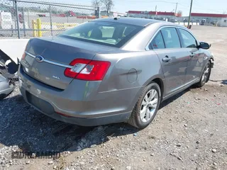 2011 Ford Taurus SEL with VIN 1FAHP2EW5BG189882, listed as a IAAI auction lot 42006542 with 208,661 mi miles. Bid and sale history available at carsss.com. Image 4.
